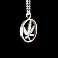 CANNABIS LEAF-HEAVY RING-PENDANT WITH 18 INCH STERLING SILVER CHAIN